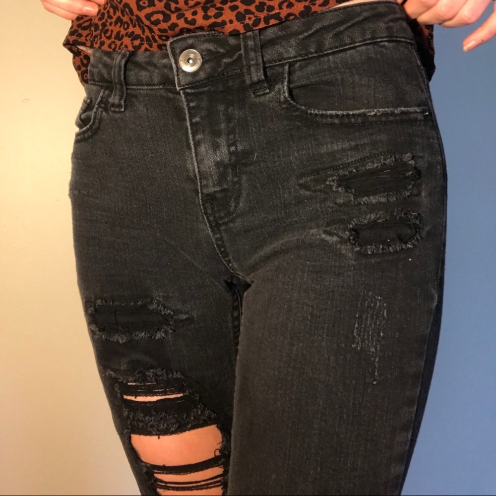 Distressed black skinny jeans